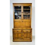 A MODERN ERCOL GOLDEN DAWN DISPLAY CABINET WITH DRAWER AND CABINET BASE W 98CM D 50CM H 197CM.