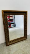 A BEVELLED GLASS GILT FRAMED WALL MIRROR 63 X 79CM.