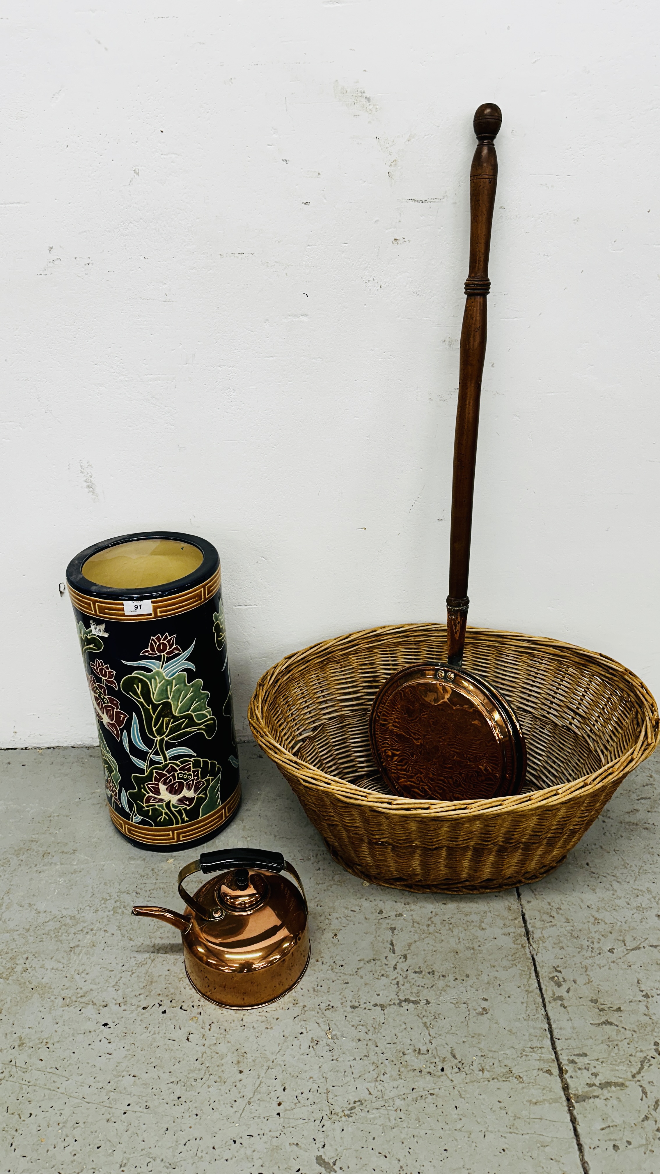 WICKER BASKET, VINTAGE COPPER WARMING PAN AND KETTLE, A MODERN CERAMIC BLUE GLAZED UMBRELLA STAND.