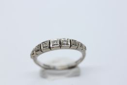 AN 18CT WHITE GOLD 9 STONE DIAMOND RING.