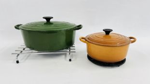 TWO LE CREUSET PANS, CAST PAN STAND AND STAINLESS PAN STAND.