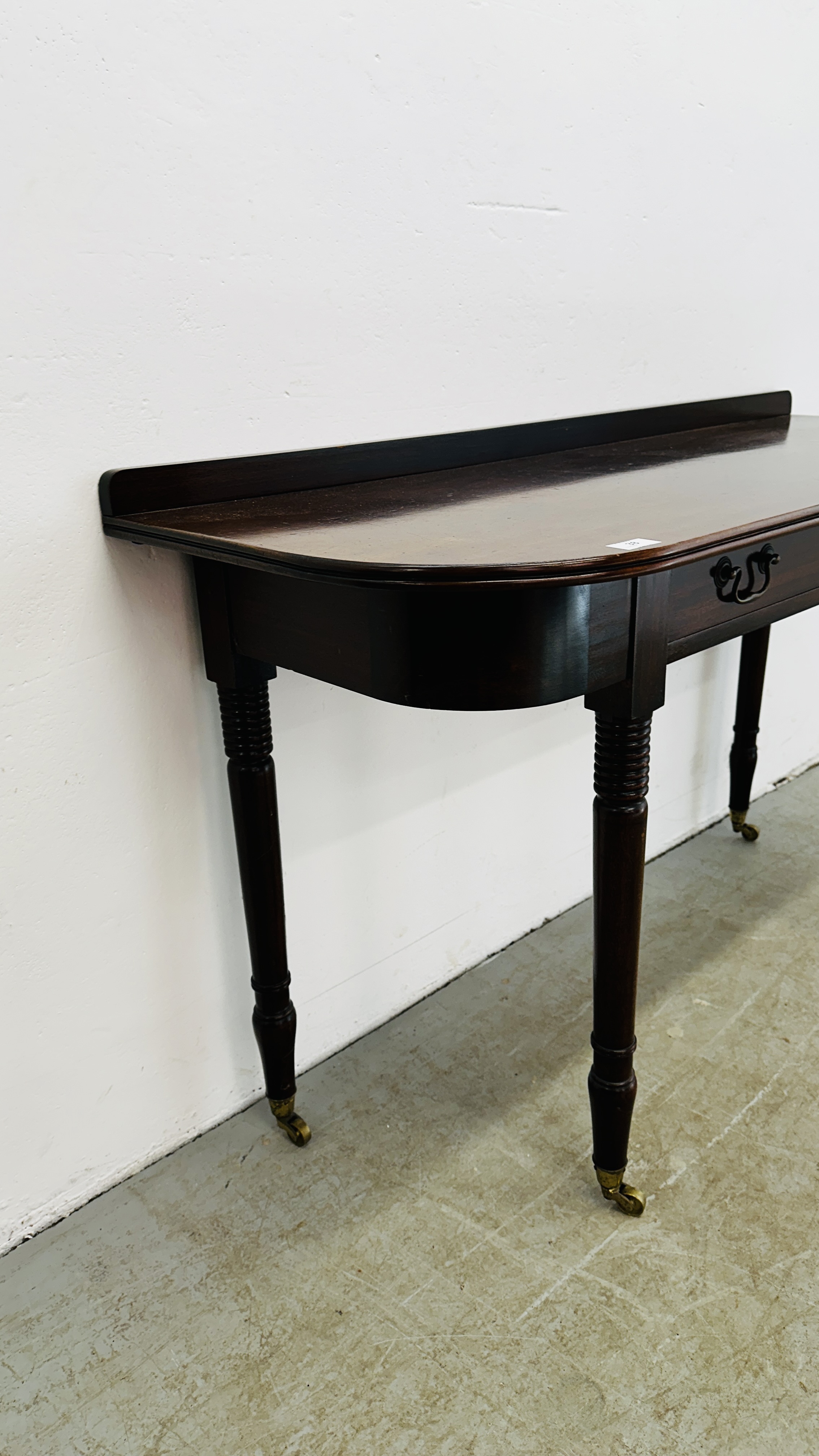 A MAHOGANY D END TABLE SUPPORTED ON BRASS CASTERS 126CM W X 49CM D X 79CM H. - Image 4 of 14