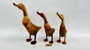 A GRADUATED SET OF 3 WOODEN HANDCRAFTED DUCKS BY THE DUCK COMPANY - TALLEST 43CM.