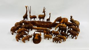 A BOX CONTAINING AN EXTENSIVE COLLECTION OF CARVED ANIMALS TO INCLUDE MAINLY AFRICAN EXAMPLES.