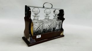 A REPRODUCTION 3 BOTTLE GLASS TANTALUS WITH KEY.