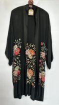 1920S BLACK SILK DRESSING GOWN WITH EMBROIDERED FLOWER DESIGN - A/F CONDITION, SOLD AS SEEN.