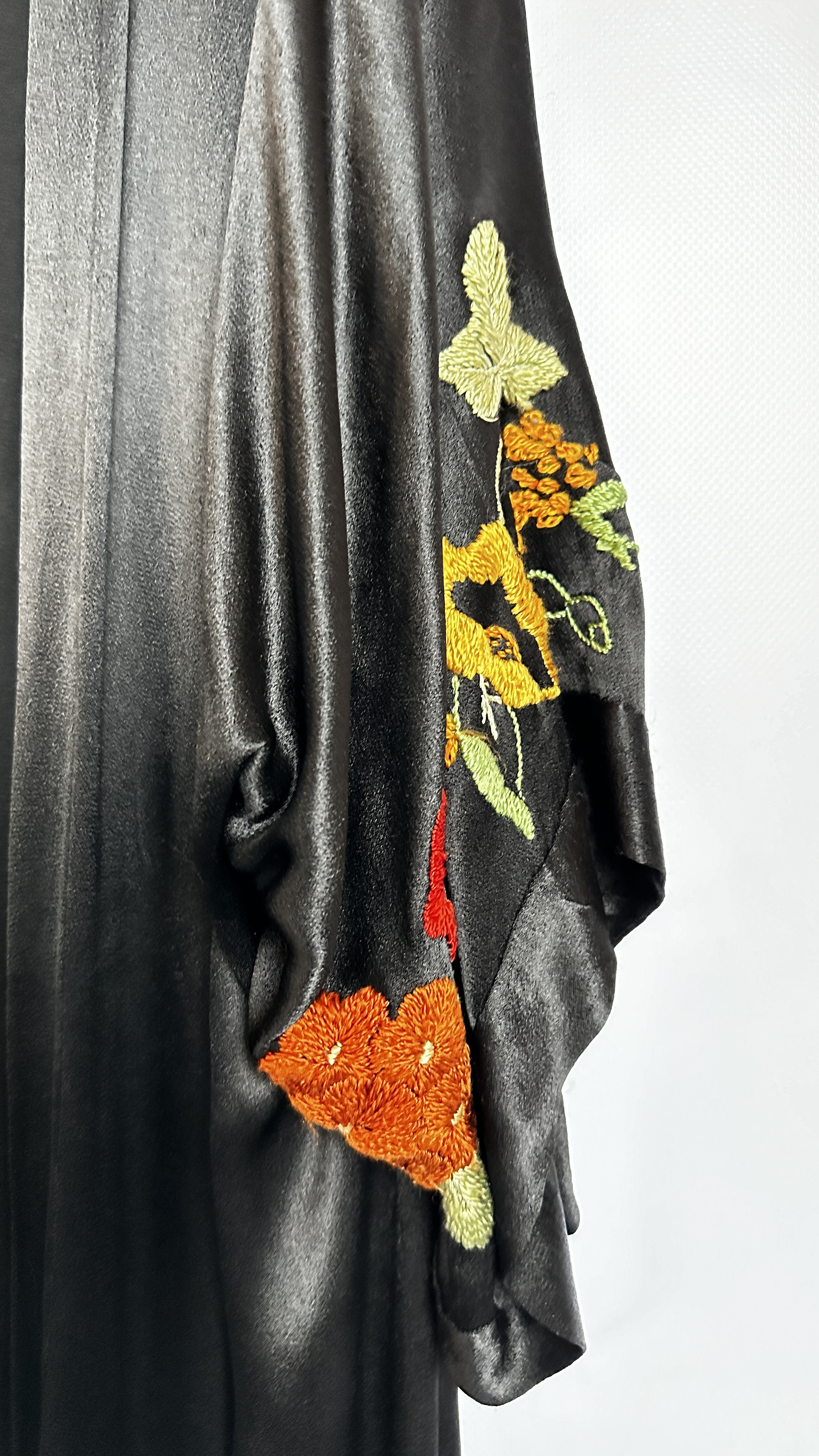 1920S BLACK SATIN ¾ LENGTH COAT WITH NASTURTIUM EMBROIDERY TO SLEEVES AND HEMLINE - A/F CONDITION, - Image 5 of 15