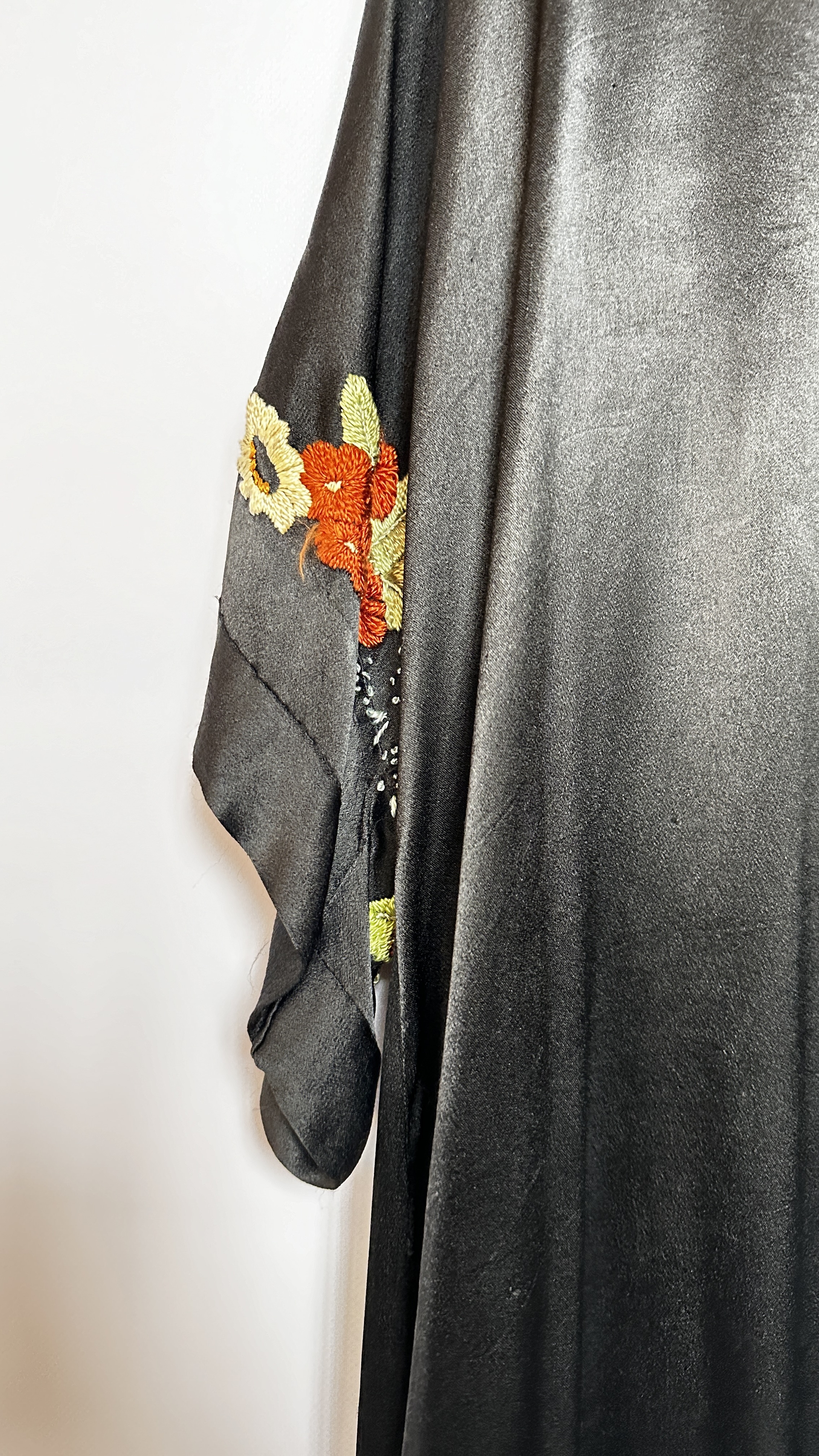 1920S BLACK SATIN ¾ LENGTH COAT WITH NASTURTIUM EMBROIDERY TO SLEEVES AND HEMLINE - A/F CONDITION, - Image 13 of 15