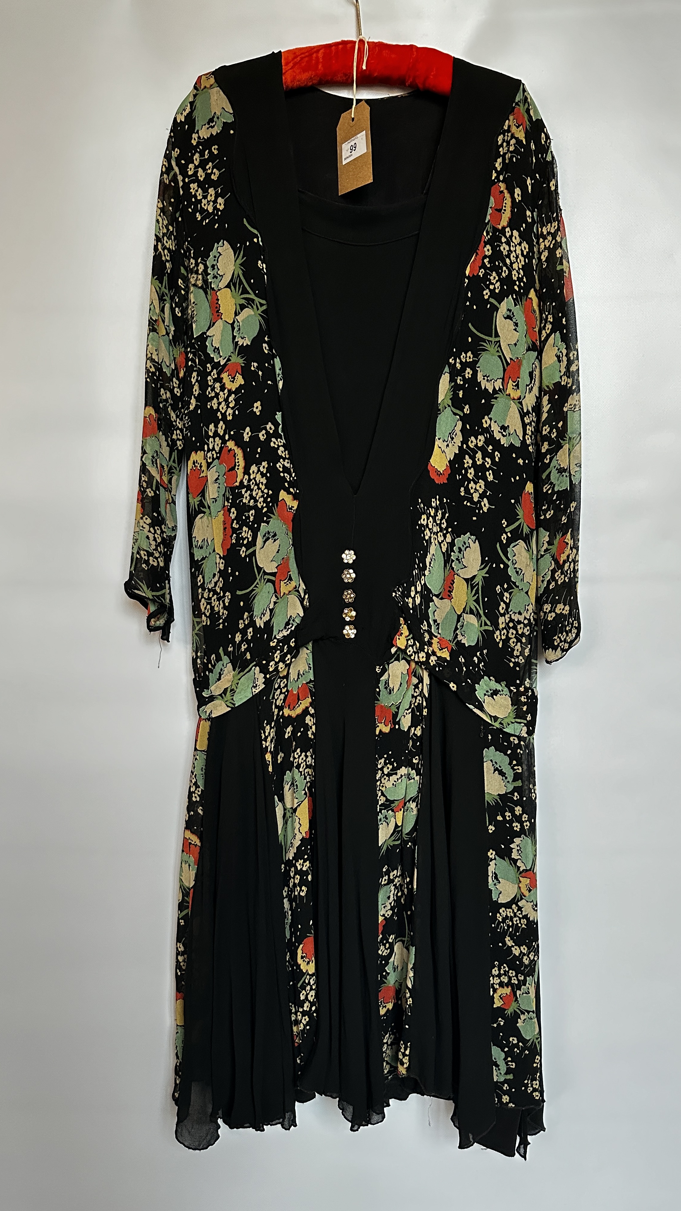 1920S BLACK CREPE AND CHIFFON DRESS, DECORATED WITH TURQUOISE/RED/ YELLOW/BEIGE FLOWER DESIGN,