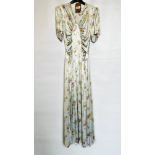 1940S PALE BLUE SATIN FLOWERED EVENING GOWN, V NECKLINE, PUFFED SLEEVES, BELTED - A/F CONDITION,