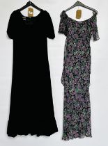 1960S EMPIRE LINE BLACK VELVET GOWN WITH PUFFED SLEEVES AND A 1970S PURPLE FLOWERED CREPE DRESS,