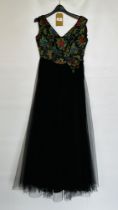 1950S BLACK NET BALLGOWN- HEAVILY EMBROIDERED BODICE WITH RED/BLUE/GREEN FLOWERS - A/F CONDITION,