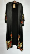 1920S BLACK SATIN ¾ LENGTH COAT WITH NASTURTIUM EMBROIDERY TO SLEEVES AND HEMLINE - A/F CONDITION,