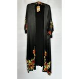 1920S BLACK SATIN ¾ LENGTH COAT WITH NASTURTIUM EMBROIDERY TO SLEEVES AND HEMLINE - A/F CONDITION,