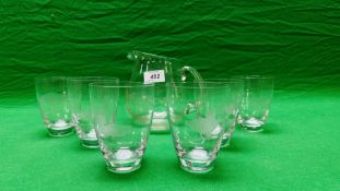 A HAND BLOWN WATER JUG AND SIX SPIRIT TUMBLERS,