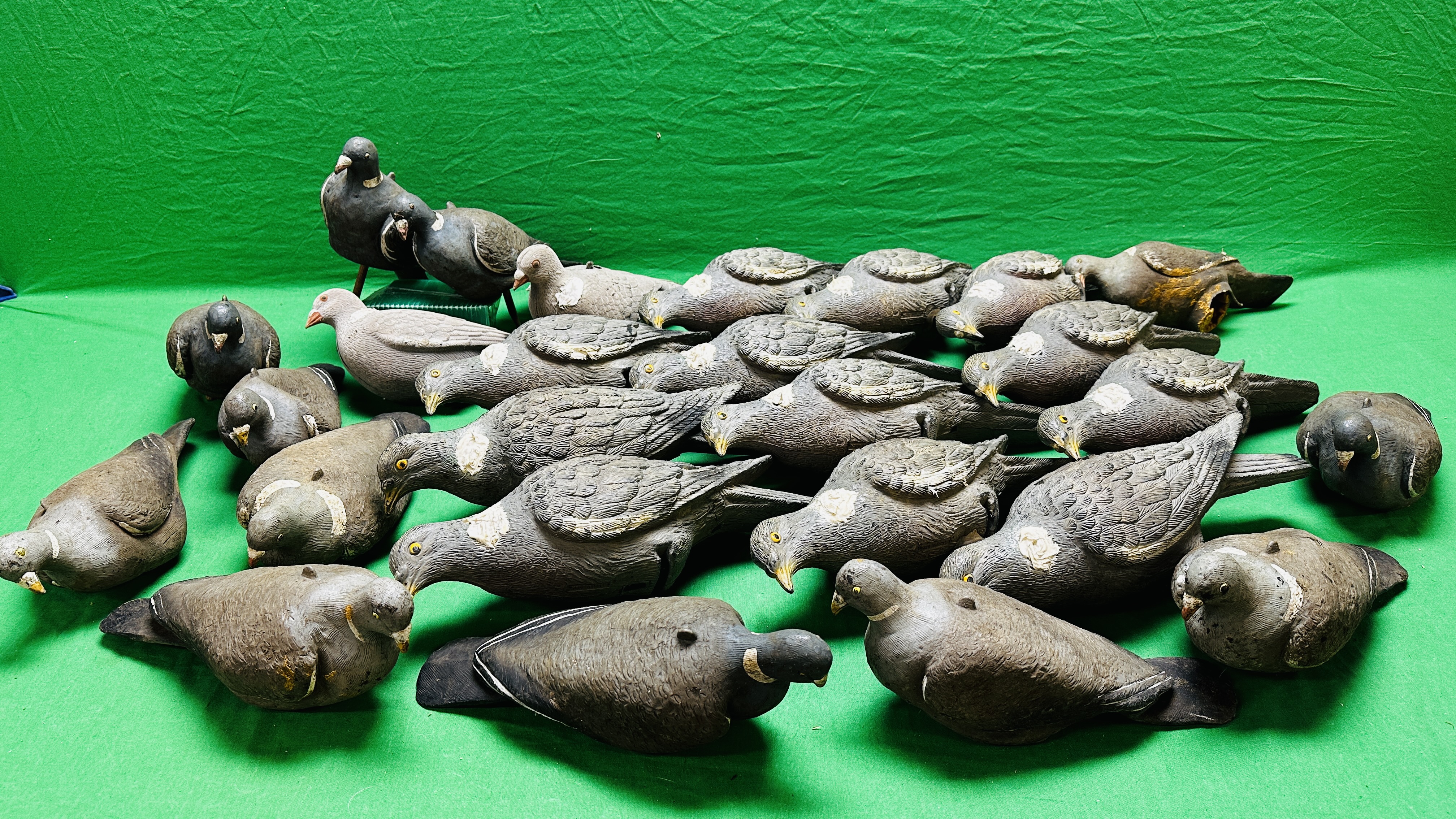A GROUP OF 26 PIGEON DECOYS.