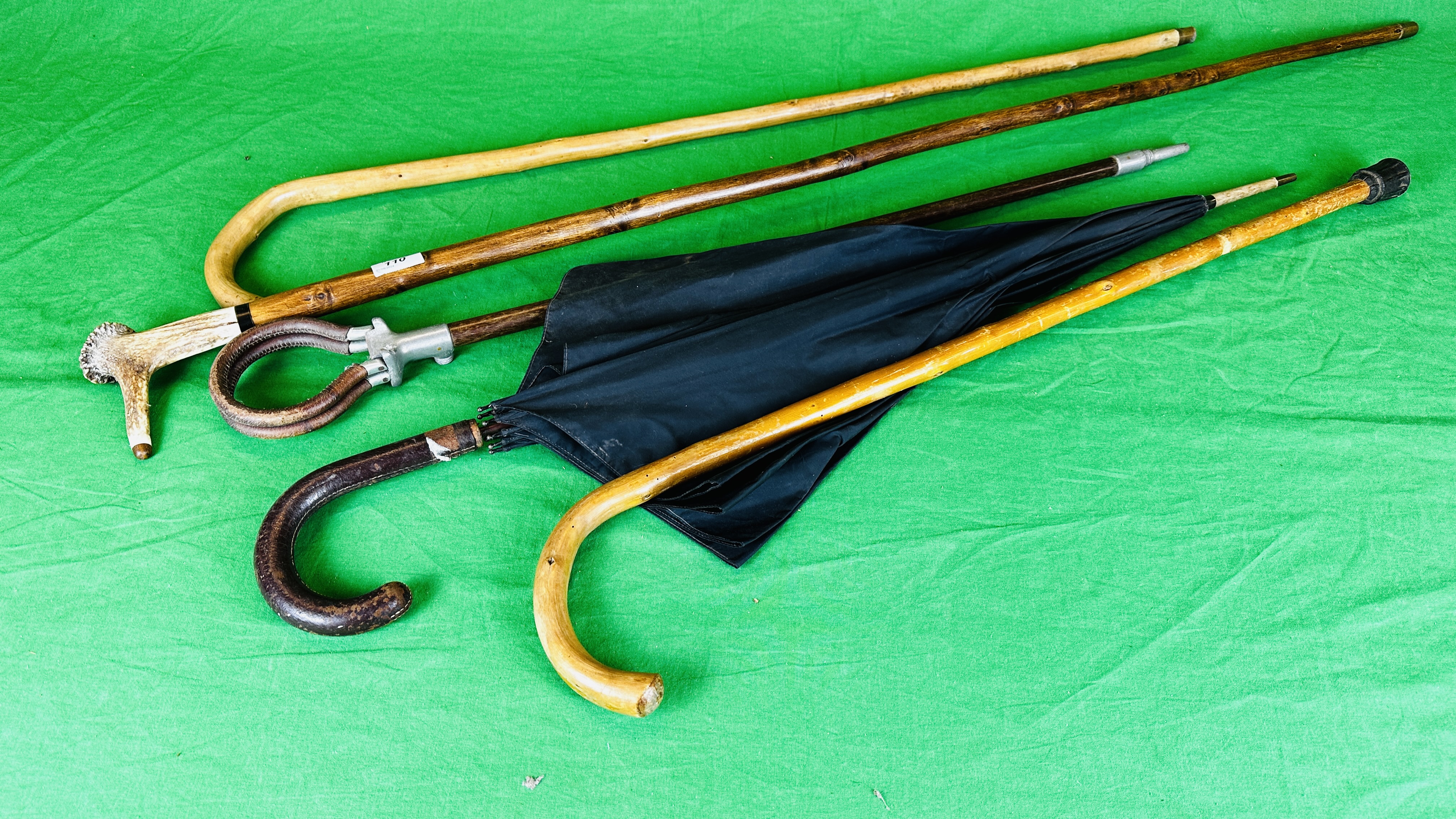 A HORN HANDLED WALKING STICK, SHOOTING STICK, TWO OTHER WALKING STICKS AND UMBRELLA.
