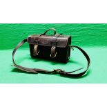 A GOOD QUALITY LEATHER CARTRIDGE BAG WITH LEATHER STRAP AND BRASS BUCKLES