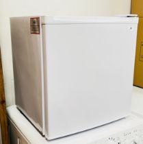 A COMPACT TABLE TOP FRIDGE - SOLD AS SEEN.