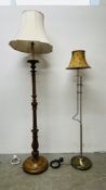 A CARVED PINE LAMP STANDARD AND CREAM SHADE AND A MODERN BRASSED ADJUSTABLE LAMP STANDARD AND