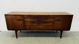 A MID CENTURY TEAK SIDEBOARD BY BEAUTILITY - FOUR CENTRAL DRAWERS FLANKED BY CUPBOARDS W 184CM D