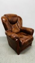 A BROWN LEATHER ARMCHAIR.