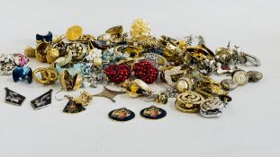 A LARGE COLLECTION OF EARRINGS.