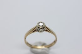 A 9CT GOLD DIAMOND SOLITAIRE RING.