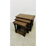 NEST OF THREE GRADUATED SOLID OAK OCCASIONAL TABLES.