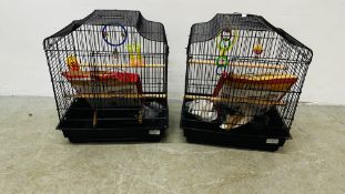TWO BUDGIE CAGES COMPLETE WITH ACCESSORIES AND SHEETS.