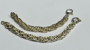 TWO DESIGNER SILVER WOVEN FANCY LINK BRACELETS.