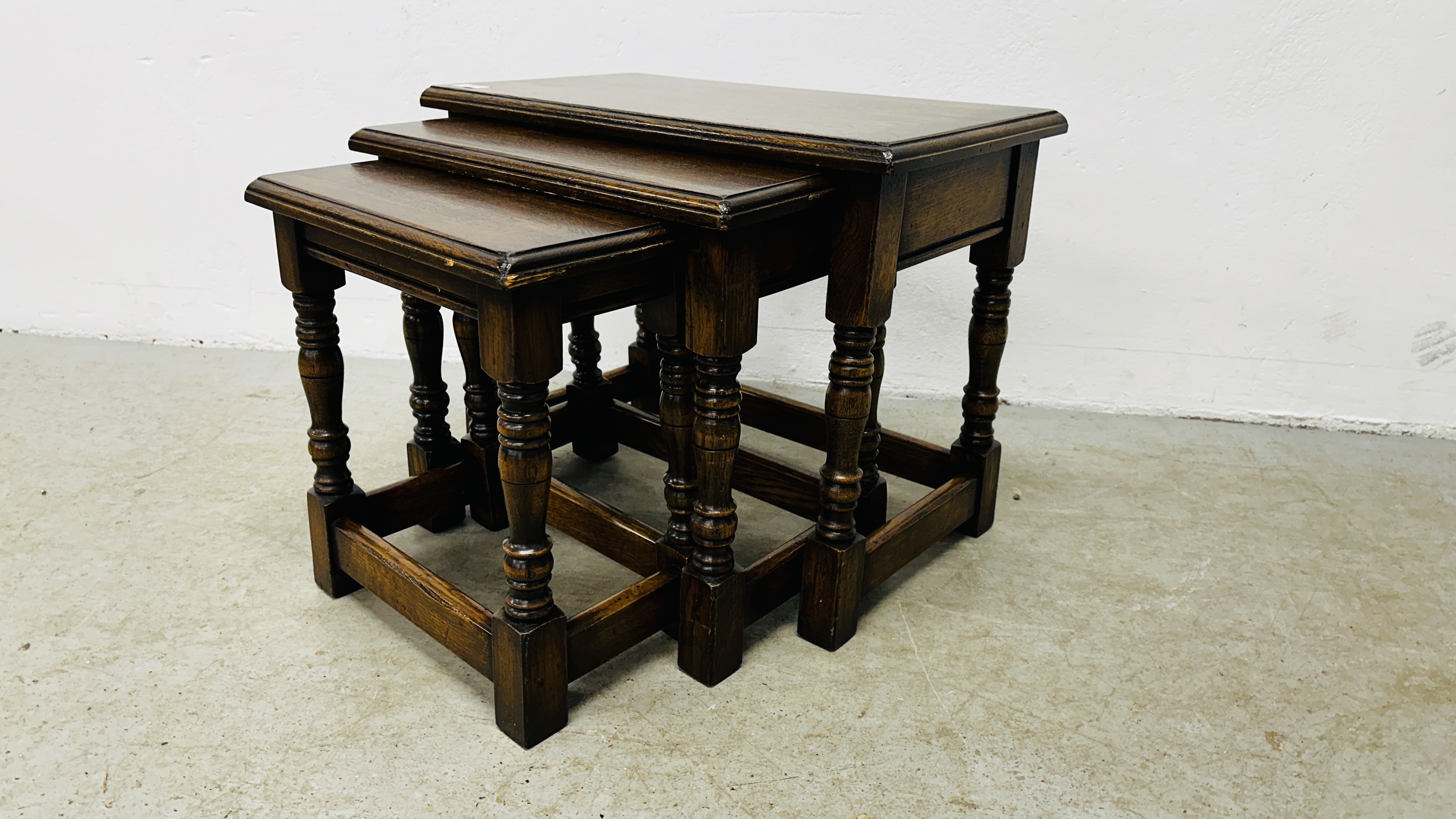 NEST OF THREE GRADUATED SOLID OAK OCCASIONAL TABLES. - Image 8 of 9
