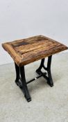 AN INDUSTRIAL STYLE OCCASIONAL TABLE, THE HEAVY CAST IRON BASE MARKED L.T.