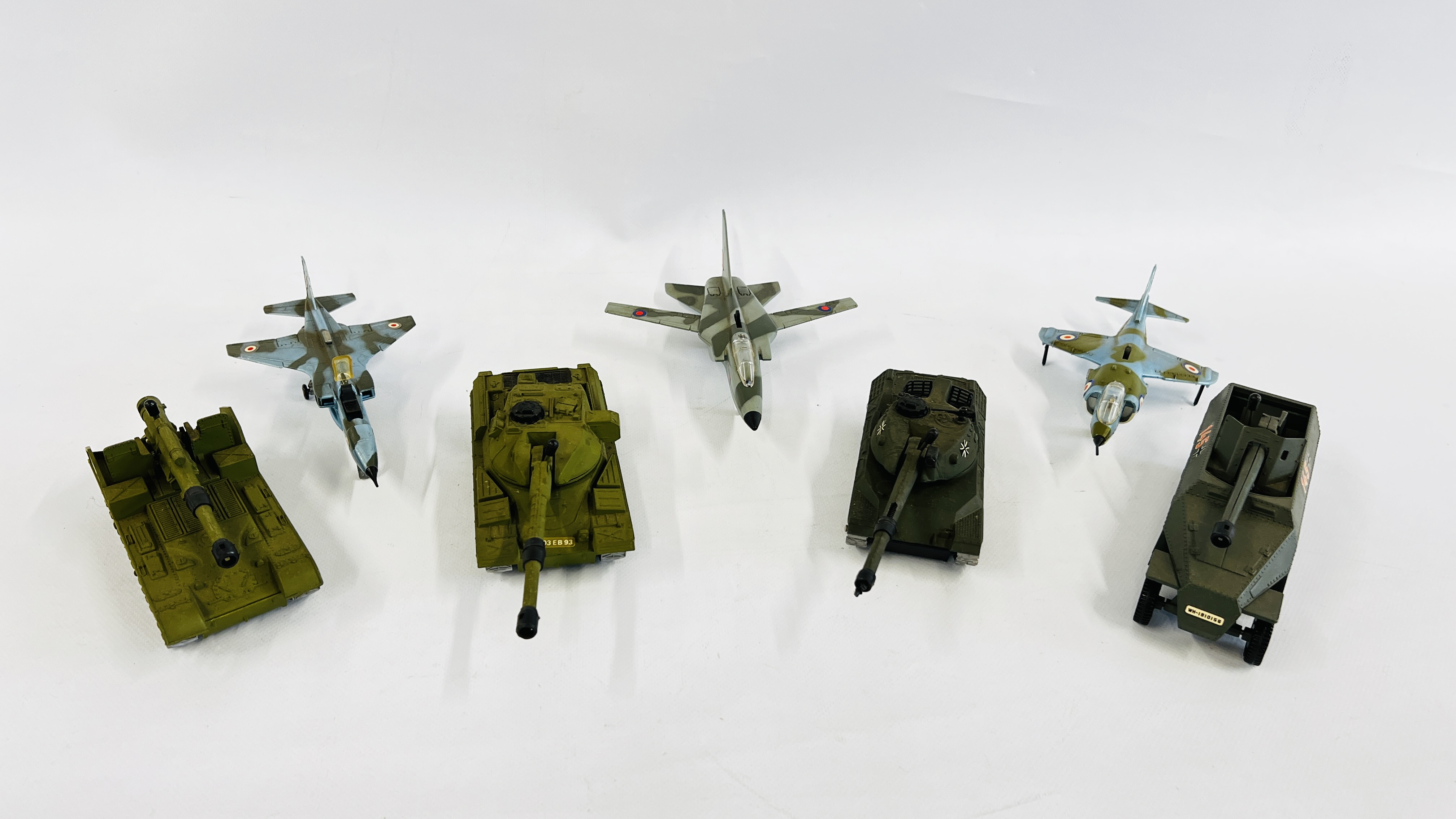 A GROUP OF 4 X DIE-CAST MILITARY DINKY TANKS ALONG WITH 4 X DIE-CAST DINKY FIGHTER PLANES / JETS.