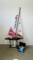 A RC FOCUS SAILING YACHT WITH PLANET CONTROLLER AND CHARGER + ACCESSORIES INCLUDING STAND.