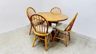 A CIRCULAR BEECH WOOD PEDESTAL KITCHEN TABLE AND FOUR CHAIRS (TABLE DIAMETER 106CM)