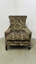 A GOOD QUALITY MODERN ARM CHAIR UPHOLSTERED IN GREEN JUNGLE PATTERNED FABRIC.