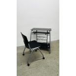 A MODERN METAL FRAMED BLACK GLASS COMPUTER DESK AND WHEELED CHAIR.