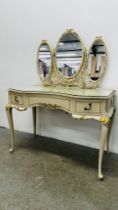 A CONTINENTAL DESIGN CREAM FINISH THREE DRAWER DRESSING TABLE WITH TRIPLE VANITY MIRRORS,