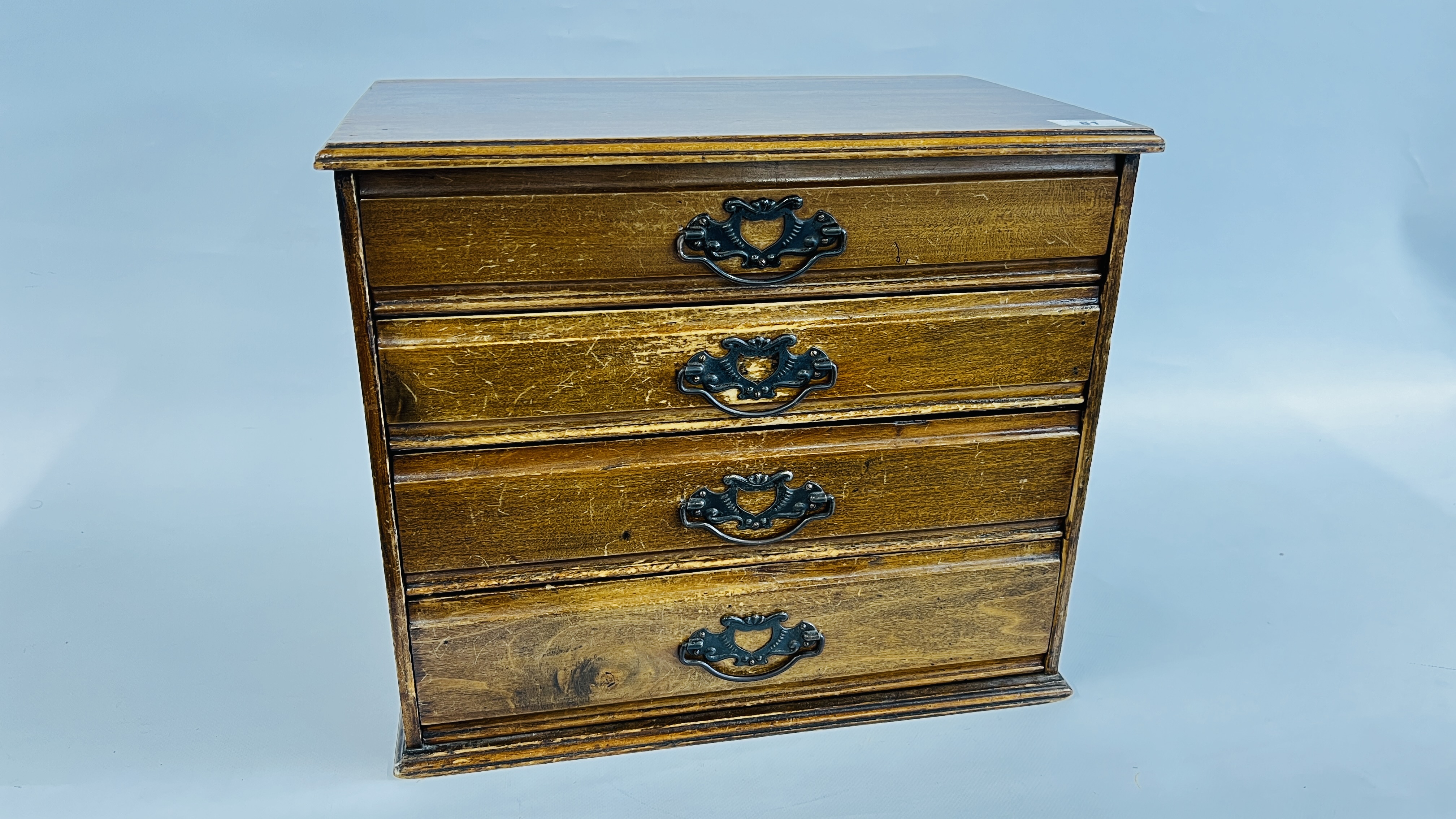 A VINTAGE MAHOGANY 4 DRAWER STATIONERY CHEST STAMPED C.A. CAMPLING LTD - W 42 X D 26 X H 34CM.