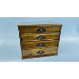 A VINTAGE MAHOGANY 4 DRAWER STATIONERY CHEST STAMPED C.A. CAMPLING LTD - W 42 X D 26 X H 34CM.