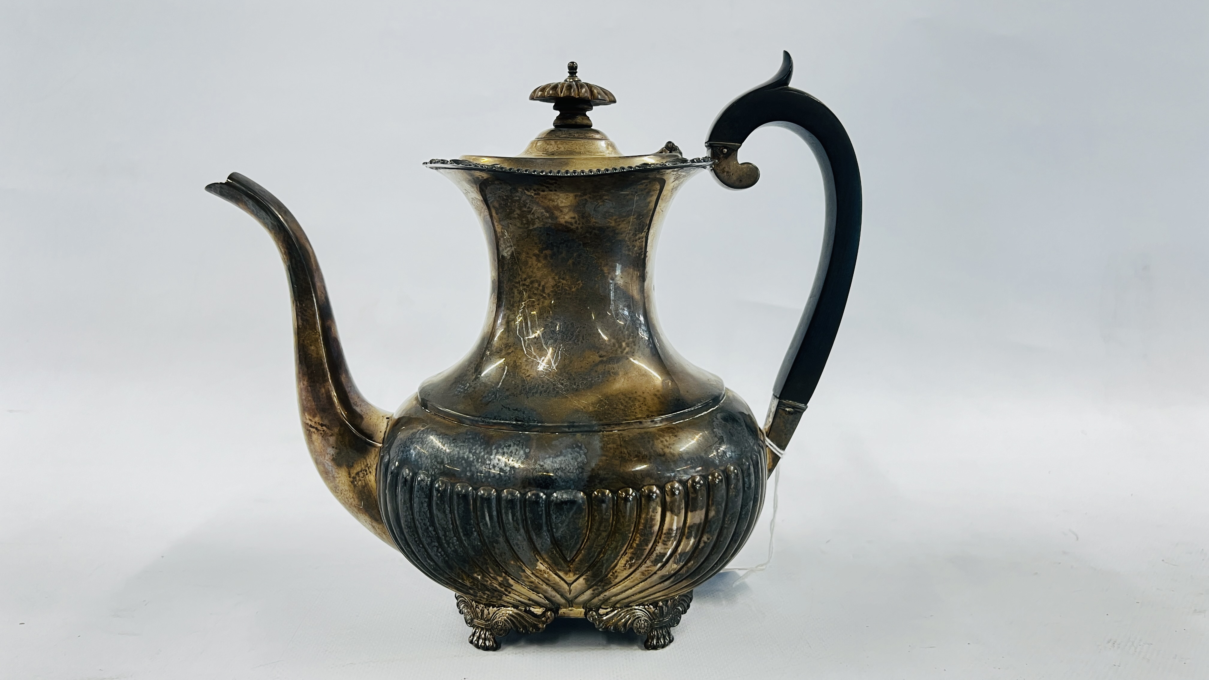 A SILVER COFFEE POT, HAVING AGADROONED BODY, BARNARD & SON,