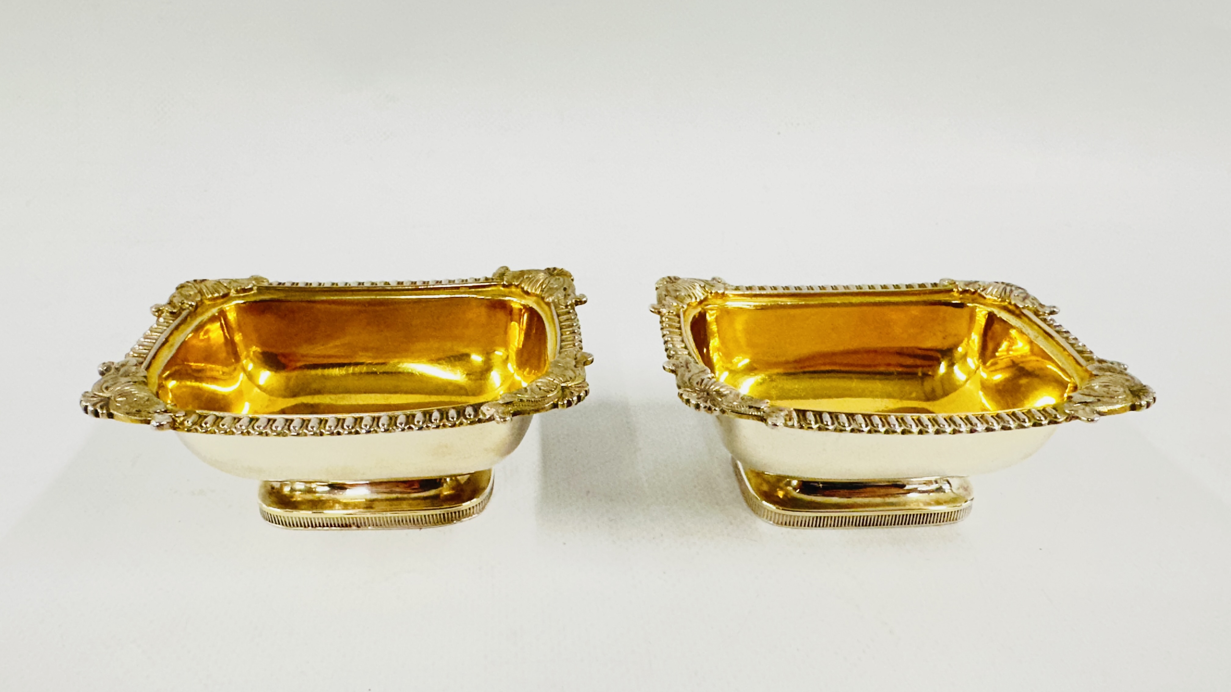 A PAIR OF GEORGE III SILVER SALTS LONDON ASSAY 1818, MAKER J. BIGGS L 9.8CM X W 7.3 X H 3CM.