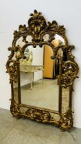 AN IMPRESSIVE REPRODUCTION GILT FRAMED CONTINENTAL STYLE MIRROR, APPROX WIDTH 100CM,