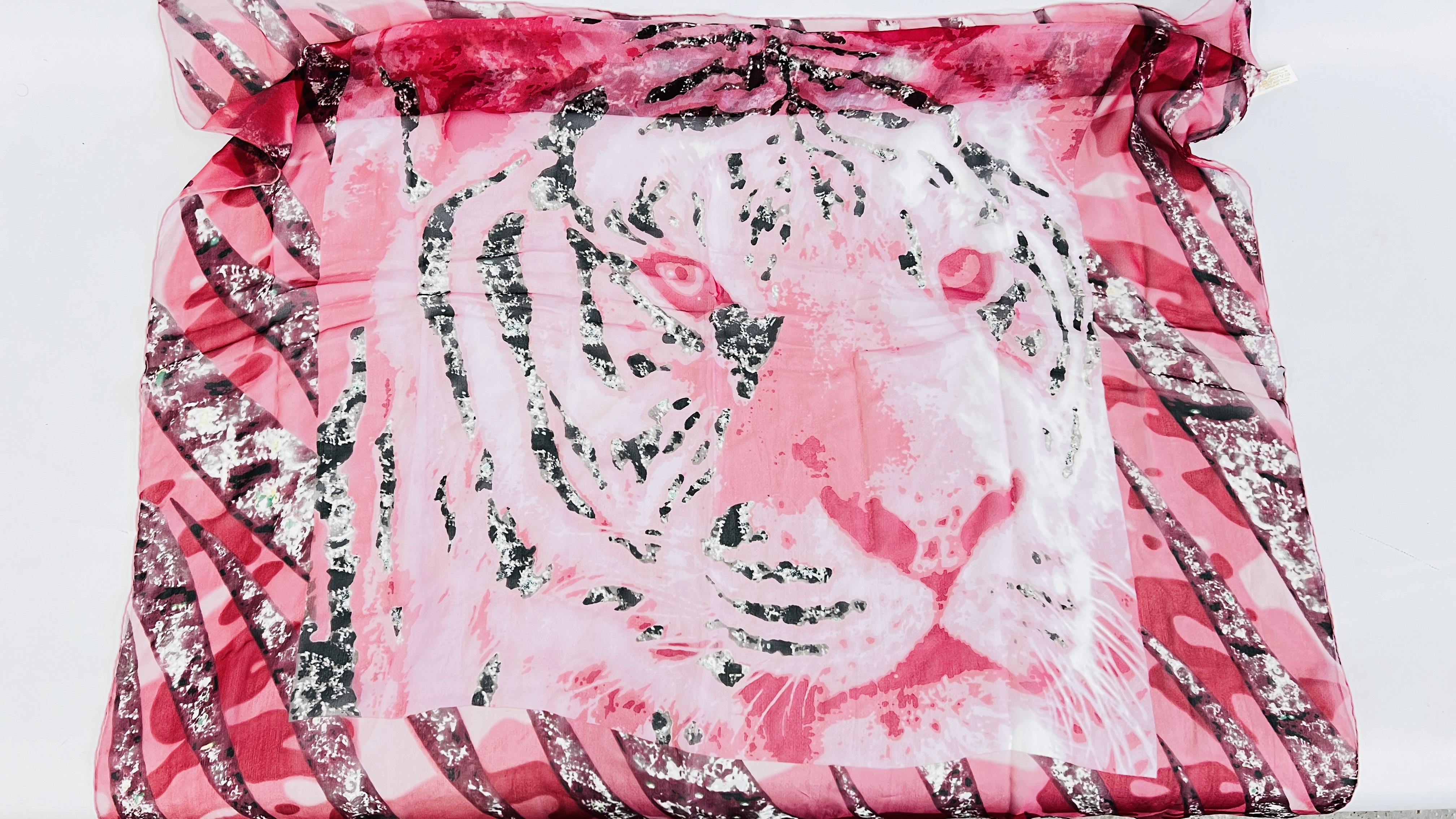 A CARTIER PINK TIGER AND CHIFFON SCARF.