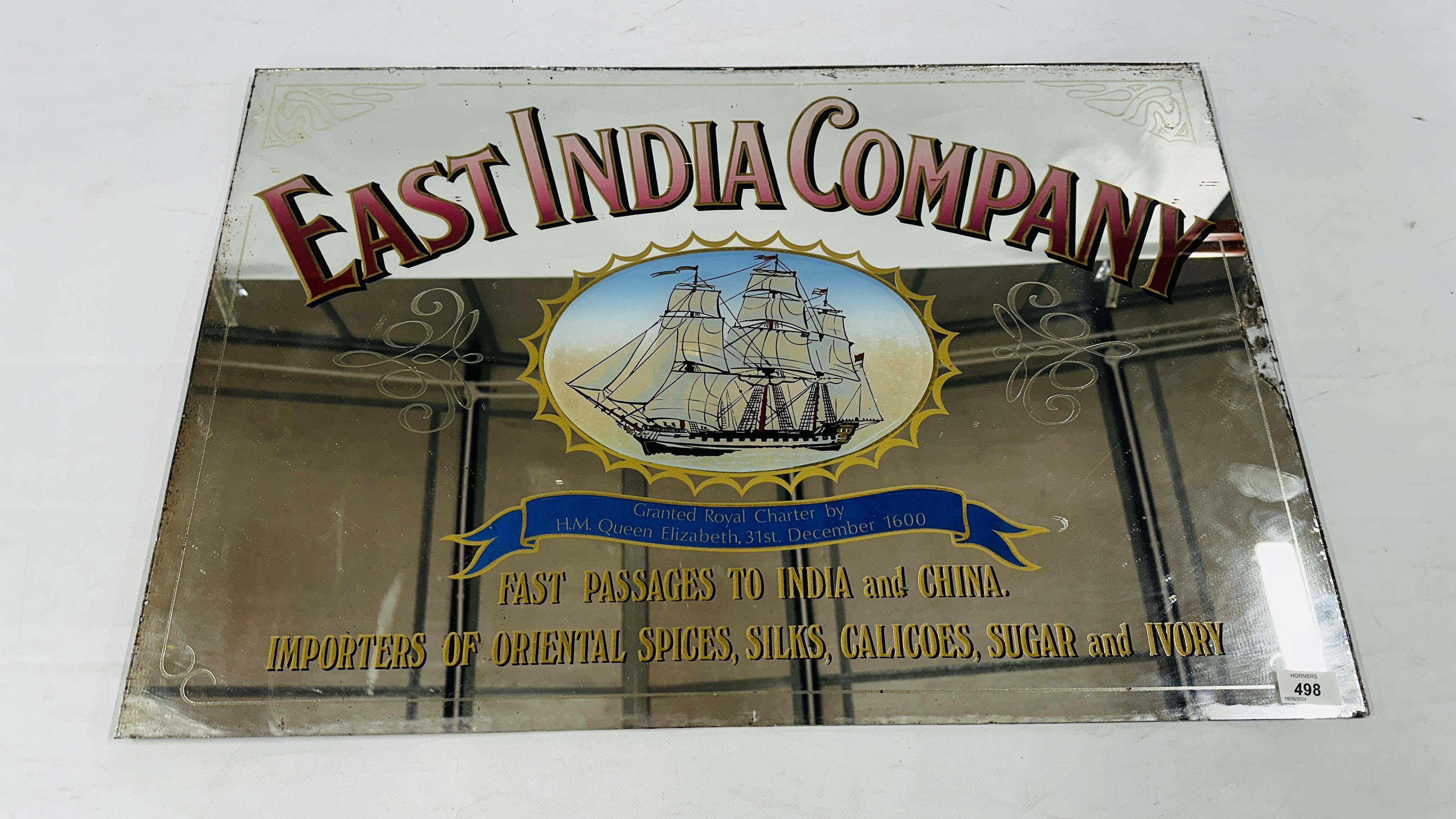 A VINTAGE EAST INDIA COMPANY MIRRORED SIGN, W 78.5CM X H 53CM.