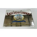 A VINTAGE EAST INDIA COMPANY MIRRORED SIGN, W 78.5CM X H 53CM.