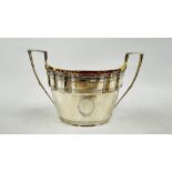 AN ANTIQUE WHITE METAL TWO HANDLED SUGAR BOWL, NO VISIBLE HALLMARKS OR MAKERS MARK L 20.5 X H 12CM.