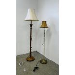 A CARVED PINE LAMP STANDARD AND CREAM SHADE AND A MODERN BRASSED ADJUSTABLE LAMP STANDARD AND