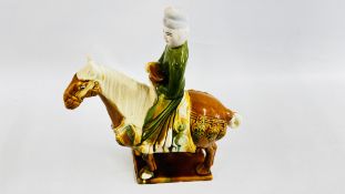 A REPRODUCTION GLAZED TANG STYLE HORSE W 28CM X H 35CM.